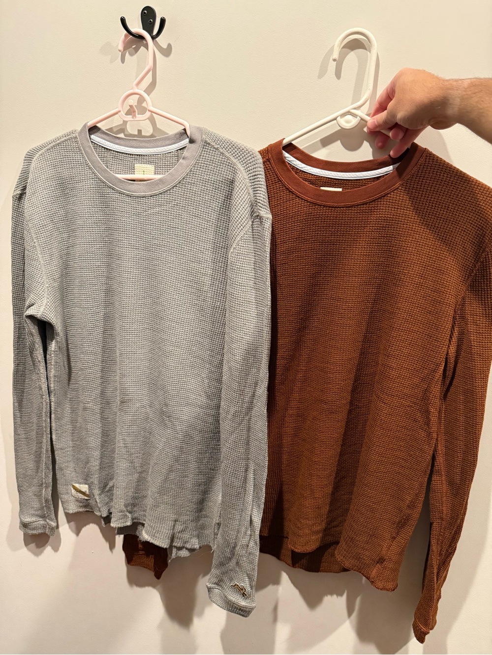 2 Tracksmith men’s size large long sleeve shirts.